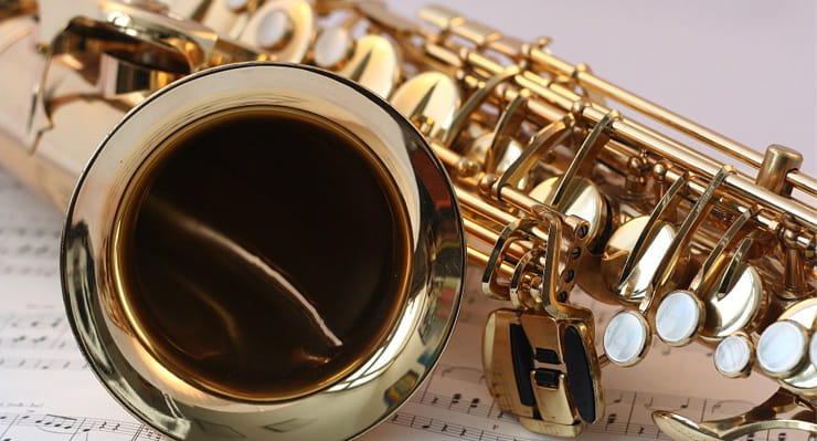Saxophone Laying on Musical Notes