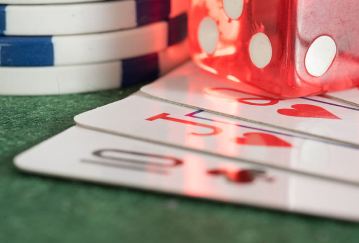 Cards Chips and Dices on a Playing Table