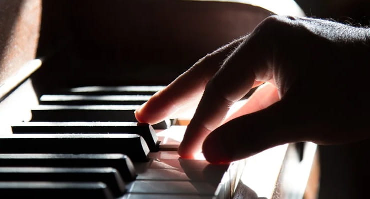 Man Playing on Piano